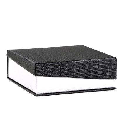 Black textured box with a white interior on a white background