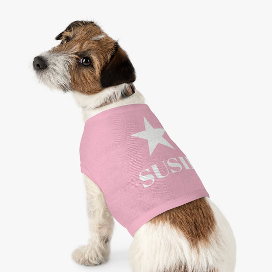 Small dog wearing custom tank top size M with white star and name design, side angle