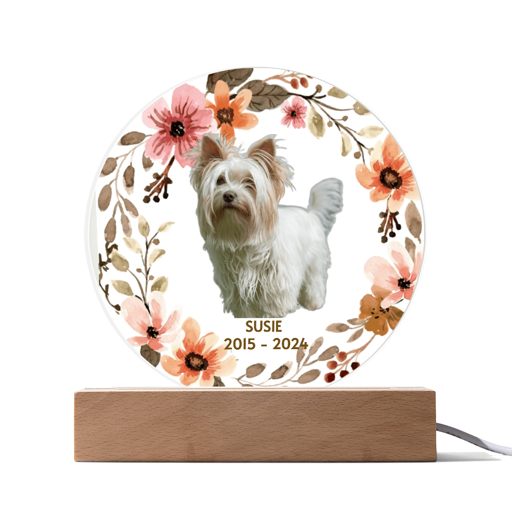 Decorative lamp with a dog's photo and floral design on a white background
